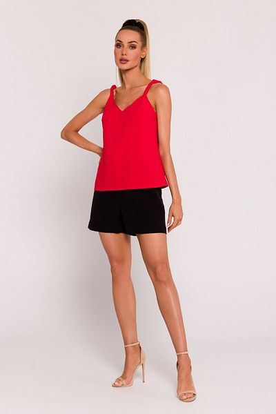 MOE This elegant top features a flattering V-neckline, twisted straps, and a deep V-cut back