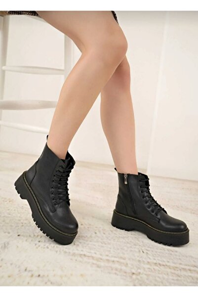 Özkan Ayakkabı SİYAH CİLT KALIN TABAN SARI DİKİŞ DETAYLI KADIN BOT