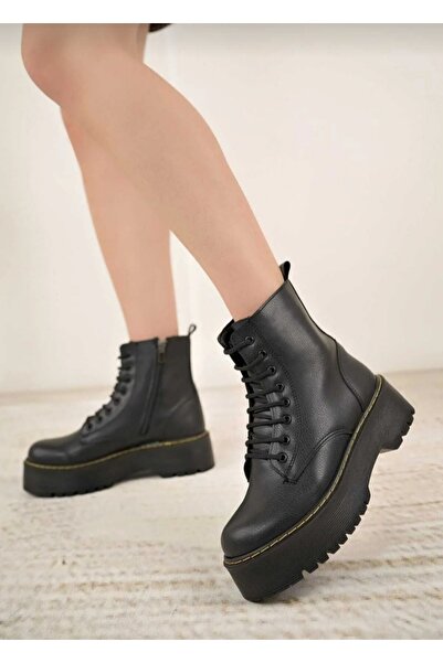 Özkan Ayakkabı SİYAH CİLT KALIN TABAN SARI DİKİŞ DETAYLI KADIN BOT