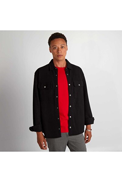 KIABI قميص بيكيه محبوك مع جيب باللون الأسود