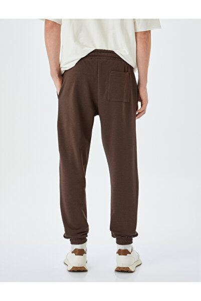 Koton Βαμβακερό μείγμα ελαστικό πόδι με λεπτομέρεια τσέπης Φούτερ με κορδόνια στη μέση