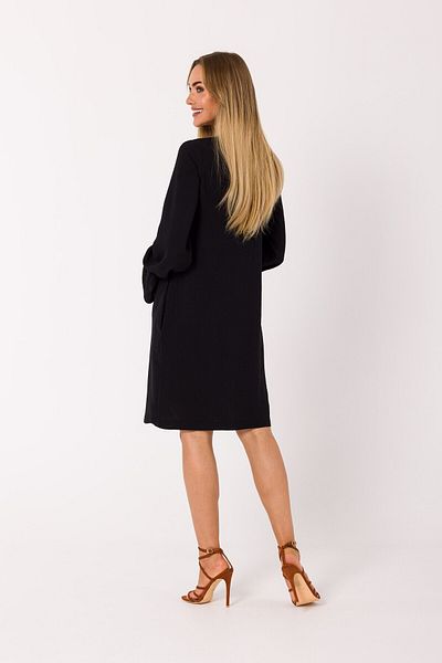 Made of Emotion This mini dress is pierced with a plunging lace-up neckline.