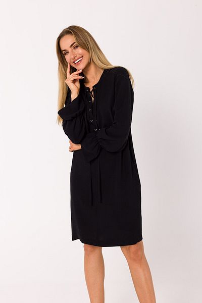 Made of Emotion This mini dress is pierced with a plunging lace-up neckline.
