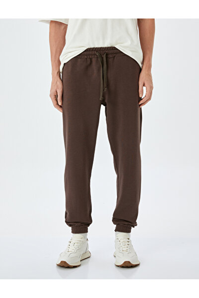 Koton Βαμβακερό μείγμα ελαστικό πόδι με λεπτομέρεια τσέπης Φούτερ με κορδόνια στη μέση