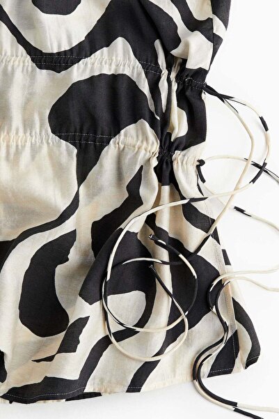 H&M بلوزة بتفاصيل رباط