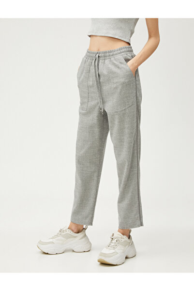 Koton Kalhoty Relax s kapsami a vázaným pasem