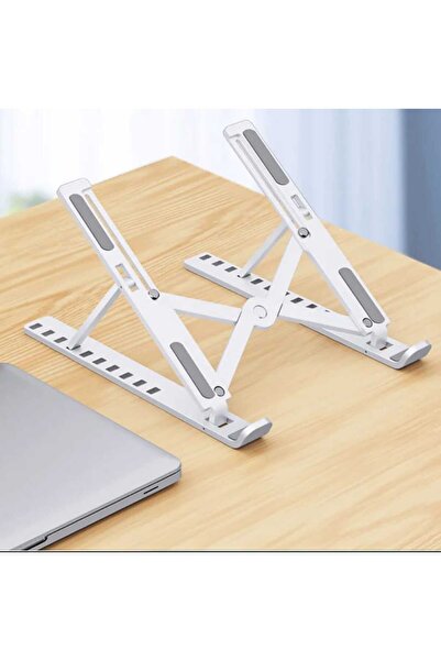 İthal حامل كمبيوتر محمول مغناطيسي قابل للطي باللون الأبيض من البلاستيك.