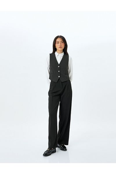 Koton Buttoned V-neck striped blazer vest.