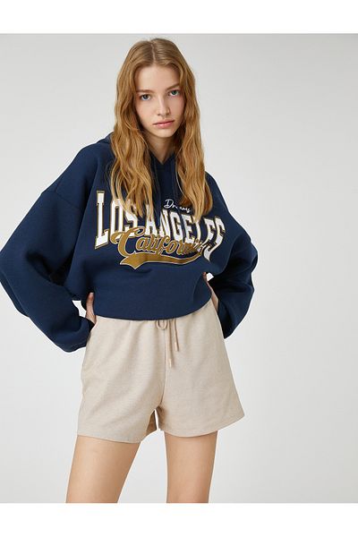 Koton Mini-Shorts mit Spitzenbund, lockerem Schnitt und detaillierten Taschen
