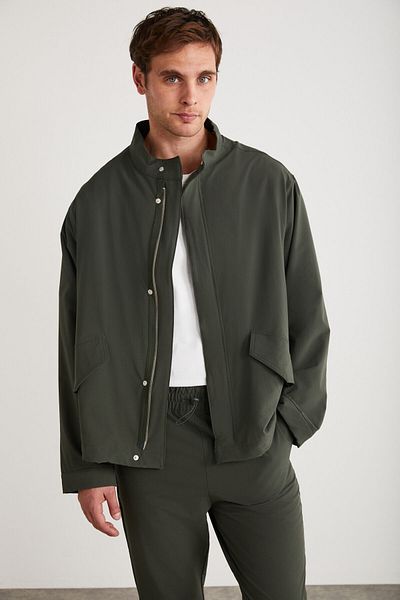 GRIMELANGE Roger Herren-Jacke aus dehnbarem technischen Stoff, dick, mit Reißverschluss gefüttert, grün, mit Ärmelbündchen und Pattentaschen