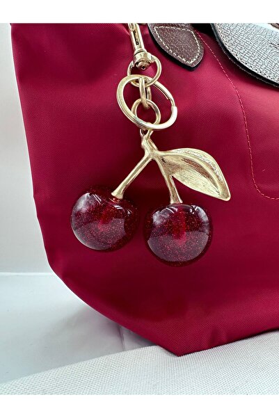 Jerie إكسسوار ساحر لحقيبة الكرز اللامعة بتفاصيل ذهبية