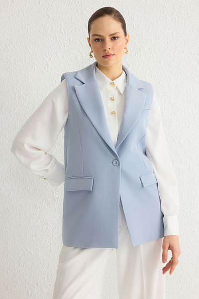 Trendyol Modest Hellblaue gewebte Weste mit einem Knopf und Taschendetail TCTAW24YL00017