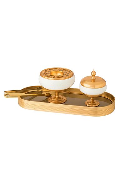 Dania A set of incense burner and oud boxes, white porcelain and gold metal, with a clamp and tongs