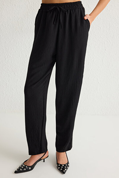 Trendyol Collection Fekete felső és elasztikus derék széles szárú/széles szárú nadrág szőtt alsó-felső öltöny TWOSS25AU00029