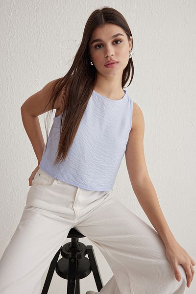 Trendyol Collection Ανοιχτό μπλε αμάνικο λινό υφαντό μπλούζα TWOSS22BZ0246