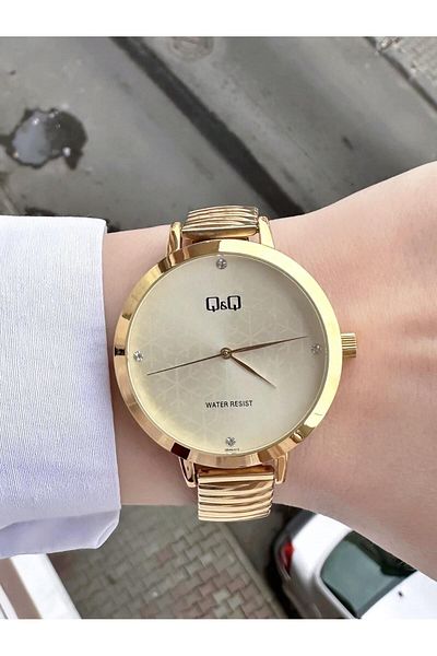 Q&Q Gold Gold Women's Watch - Bezel, Spring Cord, Cream Snowflake and Waterproof Quartz