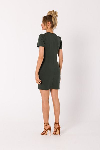 Made of Emotion A mini dress with a twist cut in cotton based fabric - a necessary summer outfit.