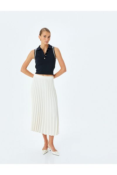 Koton Crepe fabric medium rise midi pleated skirt.