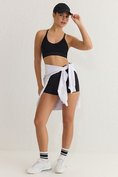 Trendyol Collection Bezešvá černá pletená sportovní podprsenka – nastavitelný popruh a síťované detaily, podpora THMSS25SS00003