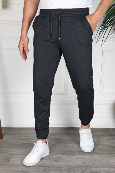 AGAINST TIME بنطال رياضي بأرجل مطاطية للجنسين