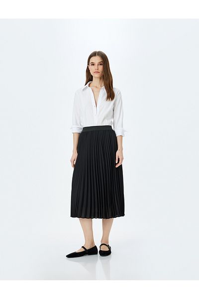 Koton Medium rise midi length pleated skirt.