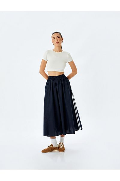 Koton Cotton side striped pocket detail midi flared skirt.