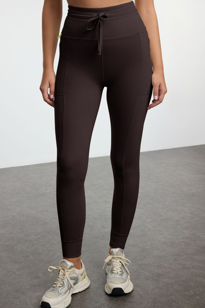 Trendyol Collection Brown Brushed Soft Fabric Full Length Knitted Sports Leggings with Pocket and Binding Detail Thmaw25Ty00014