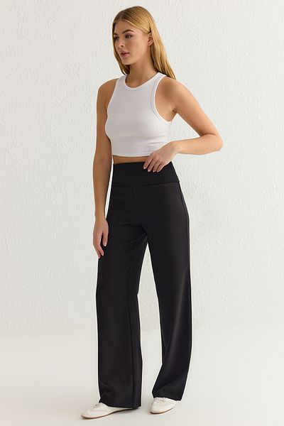 Trendyol Collection Schwarze, elastische, elastische Hose mit weitem Bein und gewebtem Bein TWOSS25PL00019