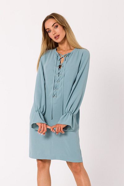 Made of Emotion This mini dress is pierced with a plunging lace-up neckline.