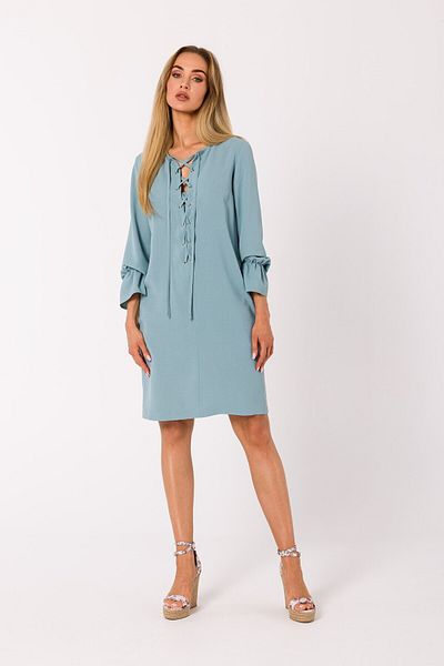 Made of Emotion This mini dress is pierced with a plunging lace-up neckline.