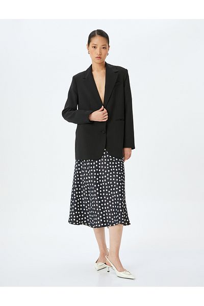 Koton Polka dot patterned midi length flared viscose skirt.