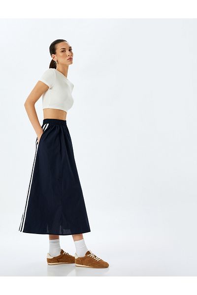 Koton Cotton side striped pocket detail midi flared skirt.