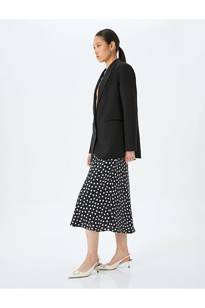 Koton Polka dot patterned midi length flared viscose skirt.