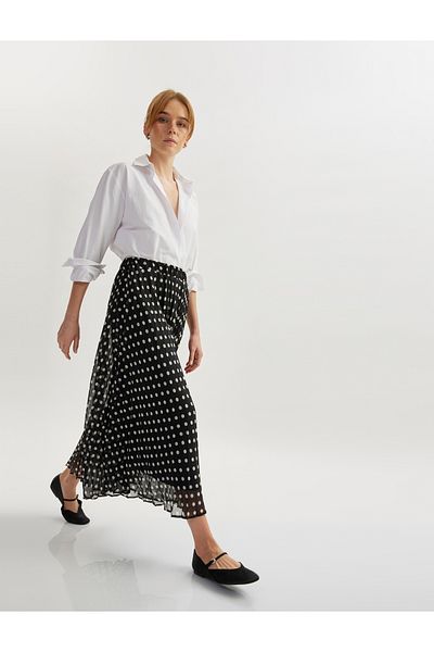 Koton Midi-length polka dot pleated flared skirt.