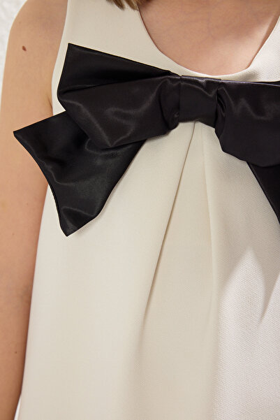 TRENDYOLKIDS Mini me tkané šaty s bílou stuhou/detailem mašle Tkdss25El00038