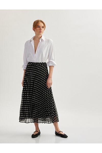 Koton Midi-length polka dot pleated flared skirt.