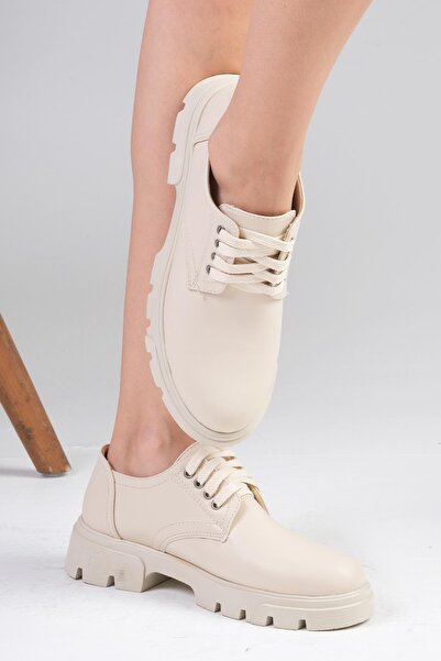 Mio Gusto Жіночі мокасини Olivia бежевого кольору на товстій підошві