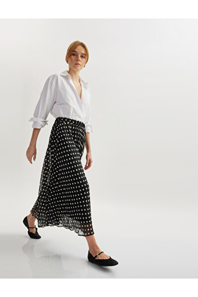 Koton تنورة واسعة ذات ثنيات منقطة متوسطة الطول