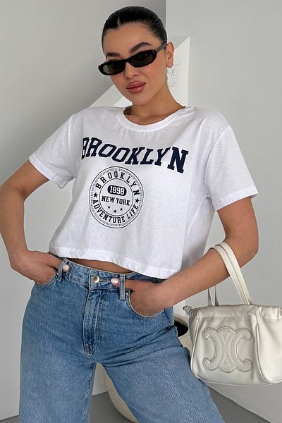 MODAGEN Women's White Crew Neck Brooklyn Printed Crop T-Shirt