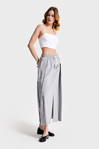 its basic Kadın Gir Renk Beli Lastlikli Yırtmaçlı Maxi Boy Tasarım Kumaş Etek