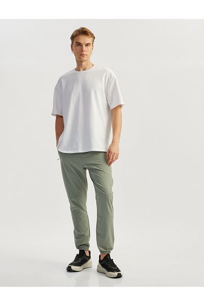 Koton Αλεξίπτωτο υφασμάτινο Jogger Sports Sweatpants με λεπτομέρεια τσέπης με φερμουάρ και ελαστική μέση