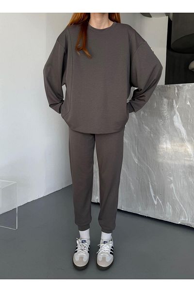 Cappmoda Tkm-1106 بلوزة فضفاضة كبيرة الحجم من القماش المدخن مع أرجل مرنة ومجموعة مزدوجة