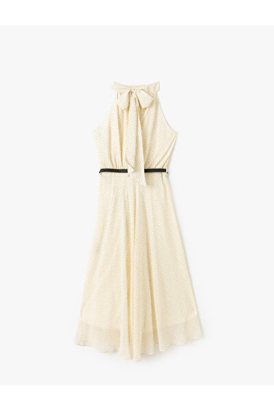 Koton Belted polka dot patterned halter neck chiffon dress.