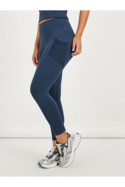 Styli بنطال ضيق بجيوب جانبية شبكية وحزام خصر عريض