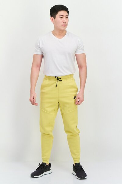 Nike Men Slim Fit Taper Leg Regular Length Training Sweatpants, Yellow