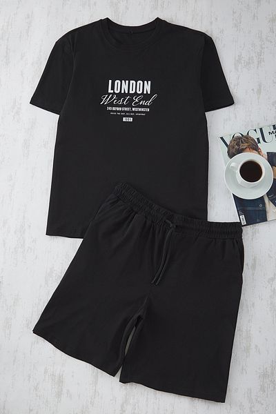 Trendyol Collection Schwarz bedrucktes Pyjama-Set mit normaler Passform und gestrickten Shorts TMNSS25PT00013