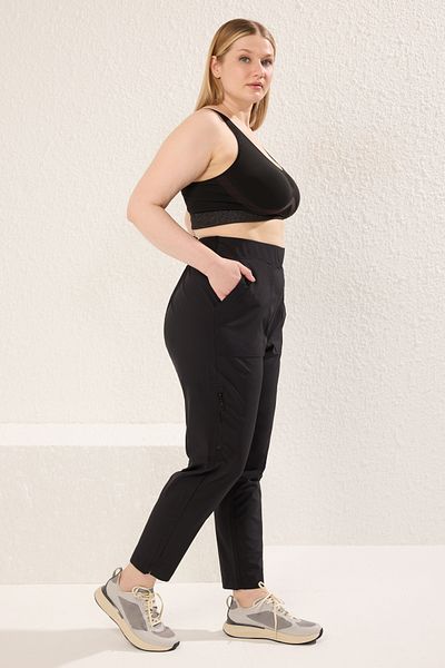 Trendyol Curve Schwarze Strickhose in Übergröße mit hoher Taille und Reißverschlussdetail – TBBSS25AR00020