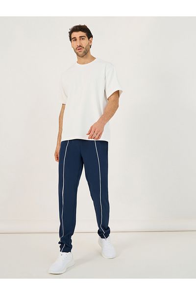 Styli 4-Way Stretch Compression Knit Slim Track Pants with Piping Detail