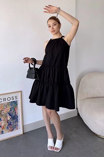 Juuuj فستان نسائي أسود بدون أكمام، رقبة رسن، نمط بلون موحد، قطع على شكل حرف A...