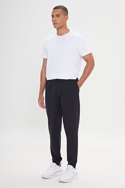 AC&Co / Altınyıldız Classics Pánské černé sportovní tepláky - pohodlný střih a elastický pas a noha